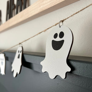 laser cut ghosts hanging from a jute twine string