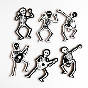 individual dancing skeletons laying on a white background